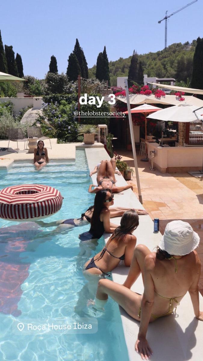 Women relaxing by the pool at Roca House Ibiza