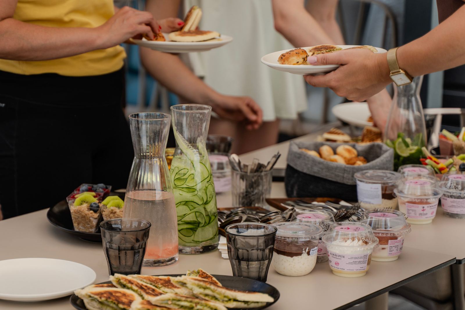 Brunch table with fresh pastries, fruit and drinks